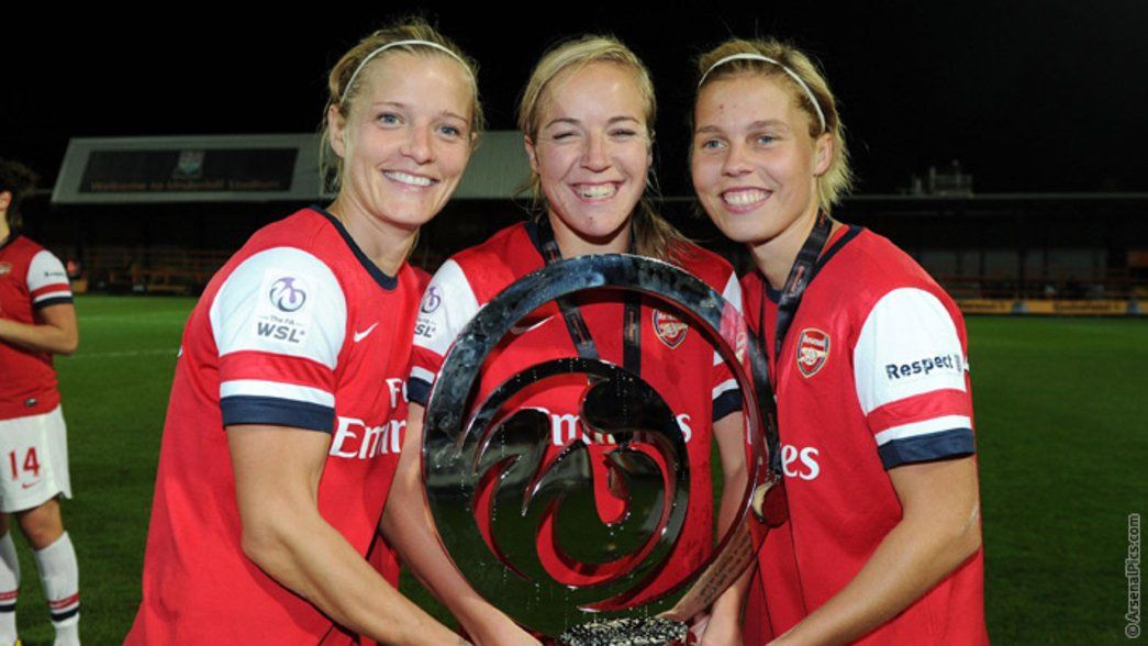 Katie Chapman (left) and Gilly Flaherty (right) with Gemma Davison and the WSL Continental Cup
