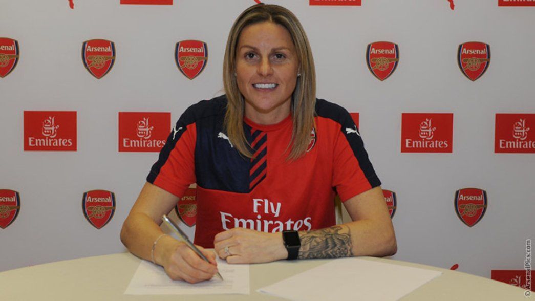 Kelly Smith signs