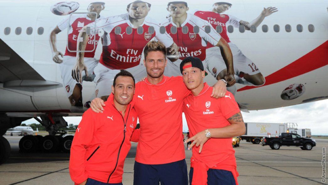 Cazorla, Giroud and Ozil in front of plane
