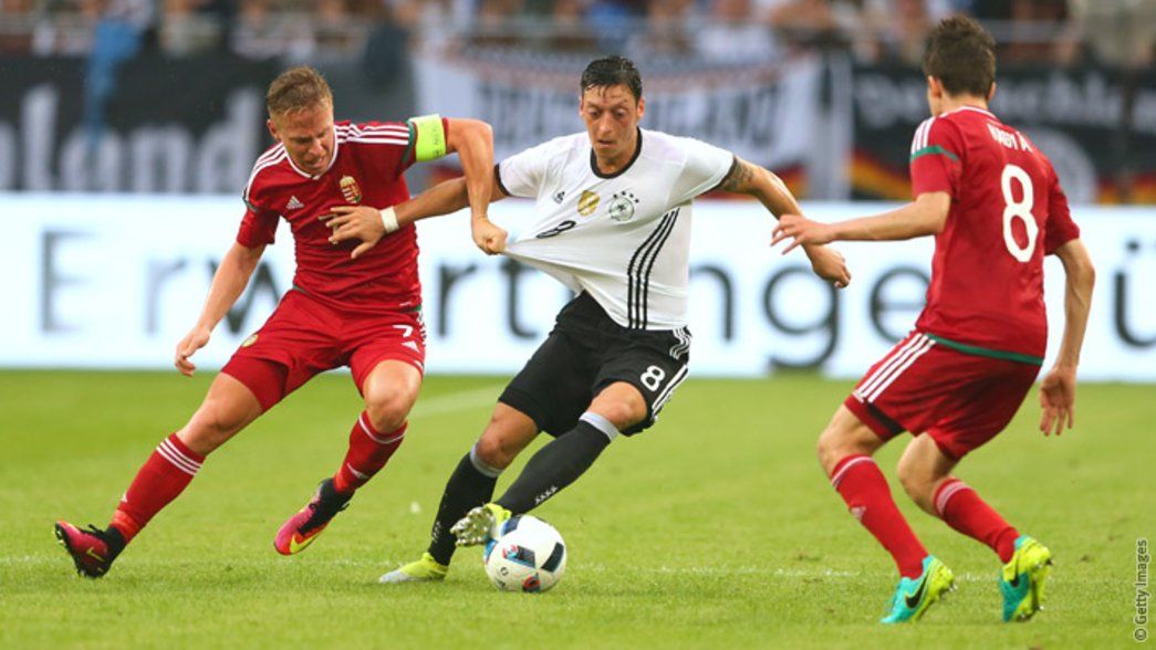Mesut Ozil in action for Germany against Poland