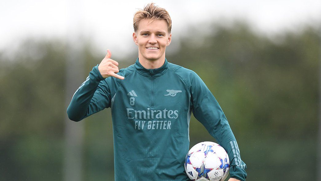 Martin Odegaard in training with a Champions League ball