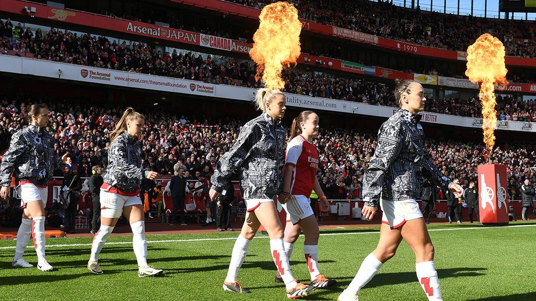 Alessia Russo and Caitlin Foord walk onto the pitch before the Barclays Women´s Super League match between Arsenal and Tottenham Hotspur at Emirates Stadium 