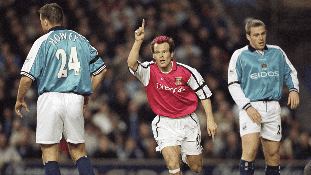 Freddie Ljungberg celebrates scoring against Manchester City in 2001
