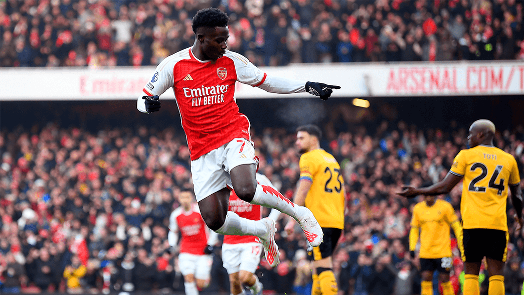 Bukayo Saka celebrates scoring against Wolves