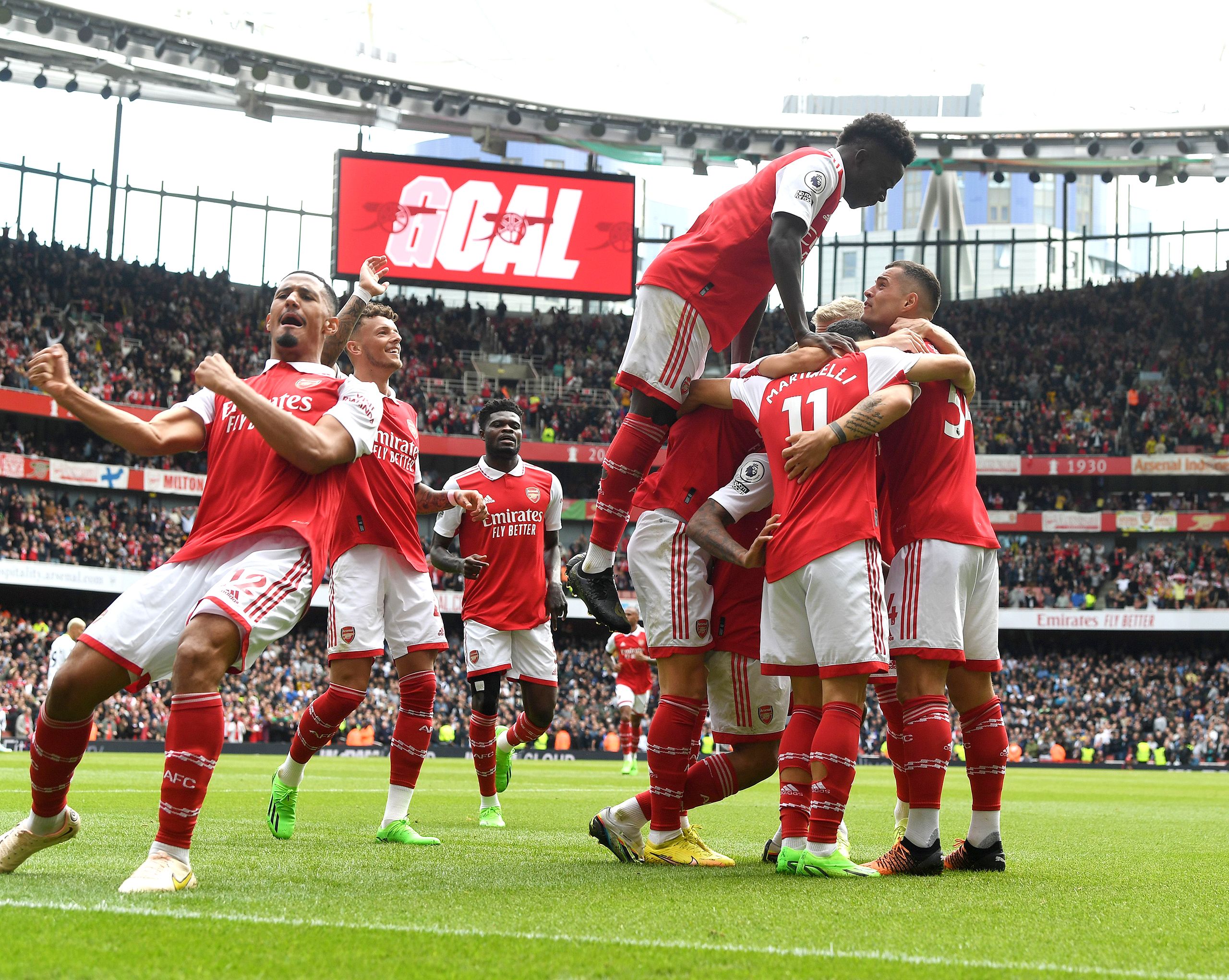 Arsenal players William Saliba, Ben White, Bukayo Saka, Gabriel Martinelli and Granit Xhaka celebrate the 2nd Arsenal goal scored by Gabriel Jesus during the Premier League match between Arsenal FC and Tottenham Hotspur at Emirates Stadium on October 01, 2022