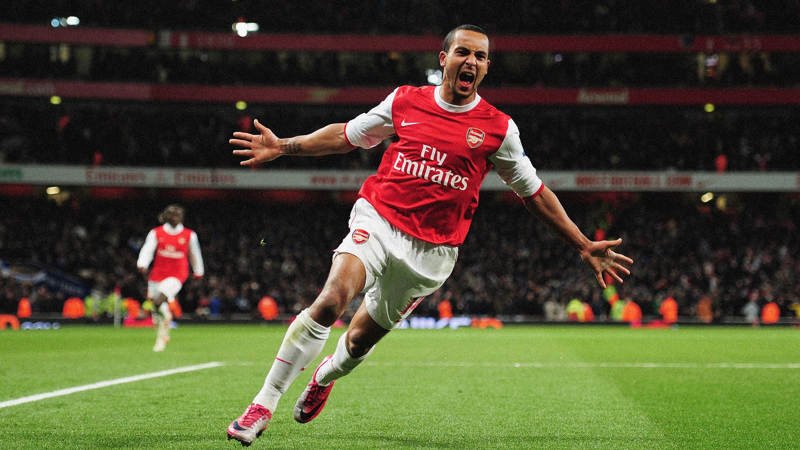 Theo Walcott of Arsenal celebrates Arsenal's third goal during the Barclays Premier League match between Arsenal and Chelsea at the Emirates Stadium on December 27, 2010