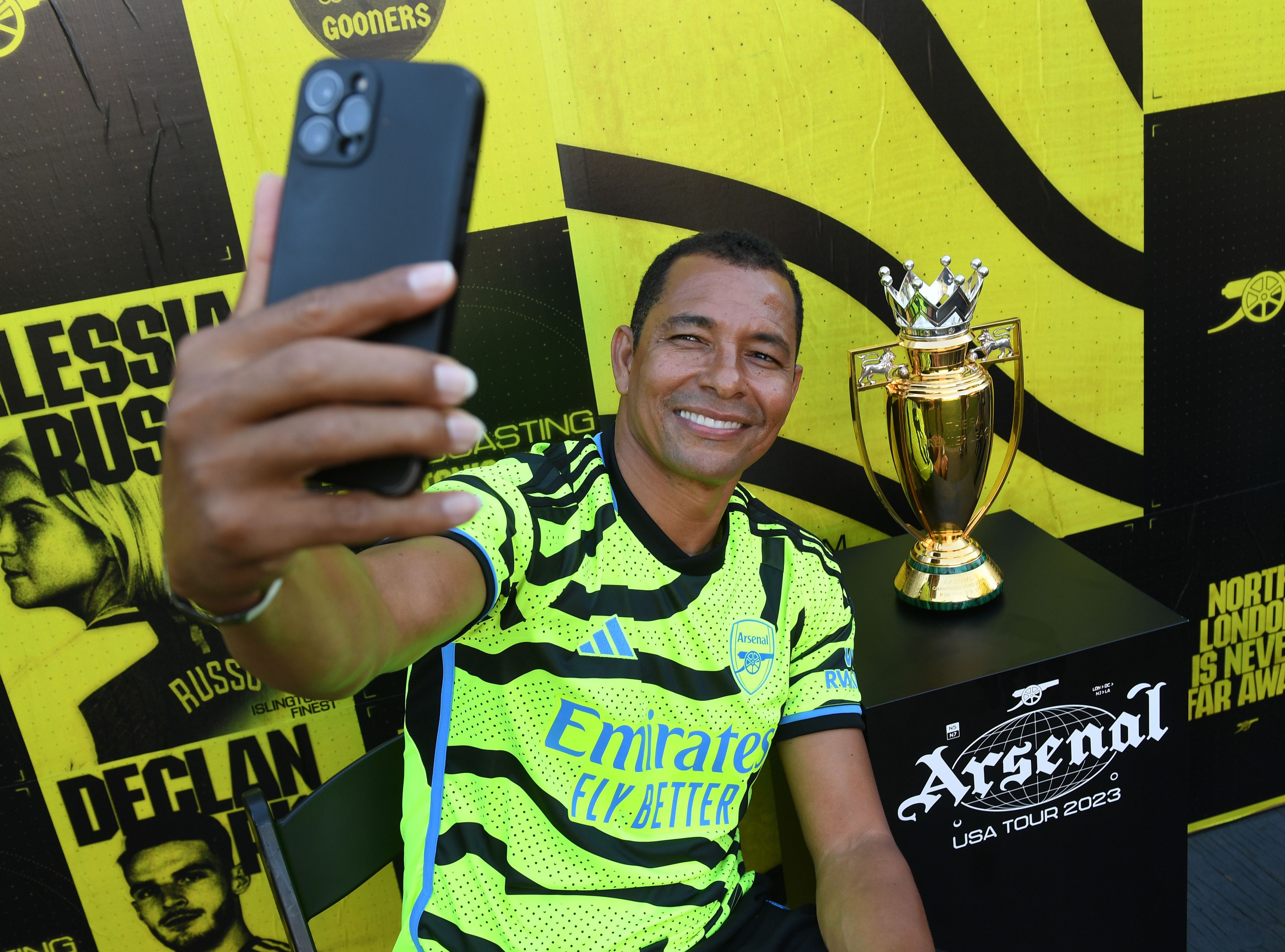 Gilberto takes a selfie with the Invincibles trophy