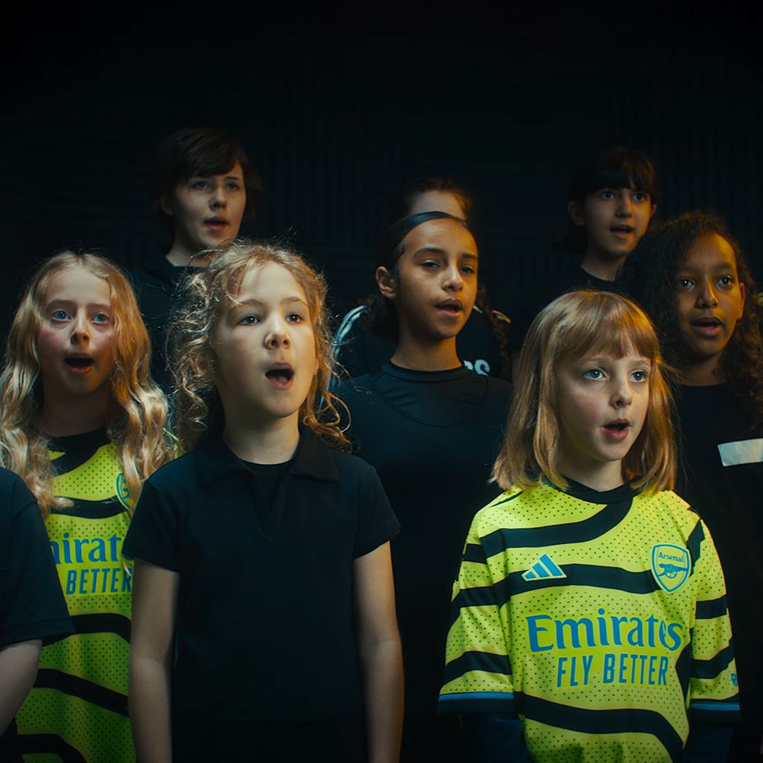 An image of members of the Highbury Youth Choir, some of whom are wearing our new men's team away shirt