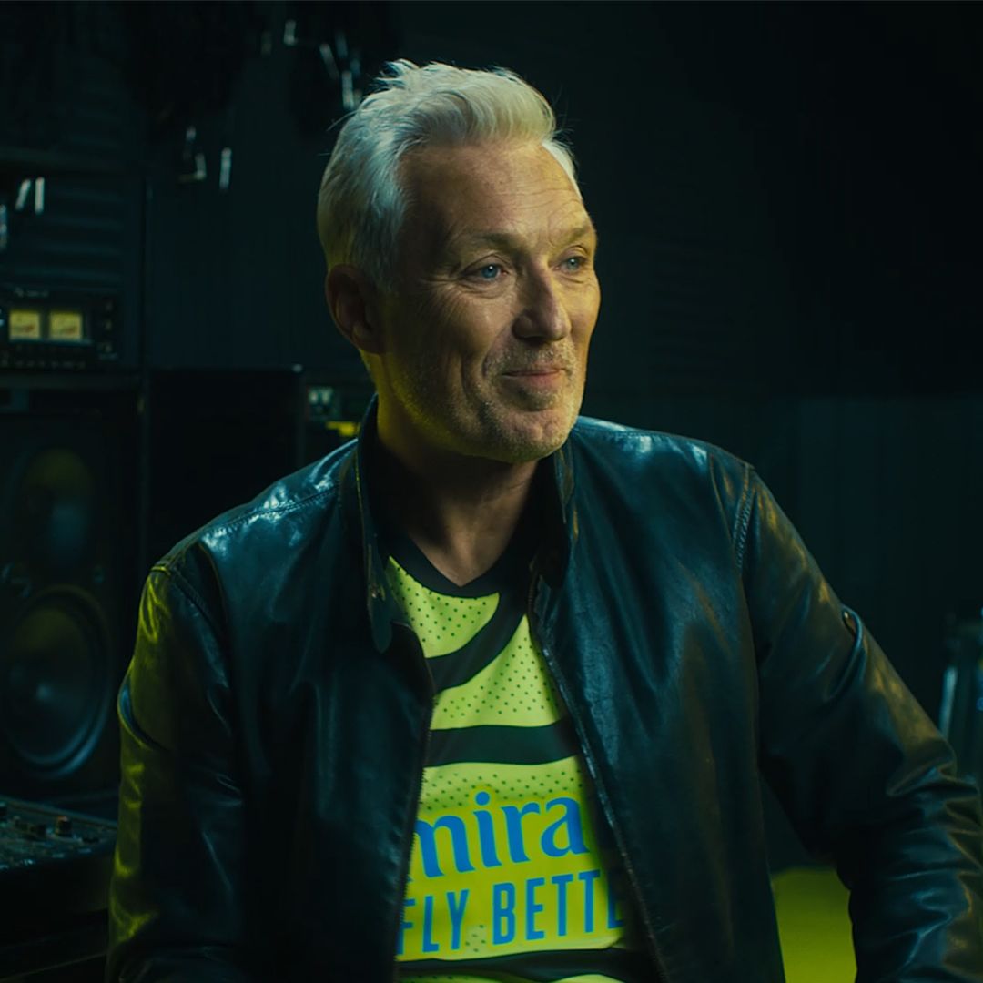 An image of a smiling Martin Kemp in our 2023/24 men's team away shirt