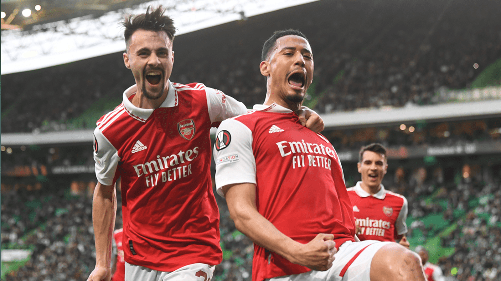 Arsenal's William Saliba celebrating his goal against Sporting CP with his teammates