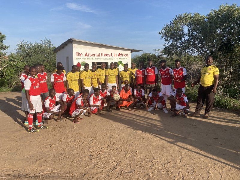The Bore Lions football team outside the Arsenal Forest Visitor Centre