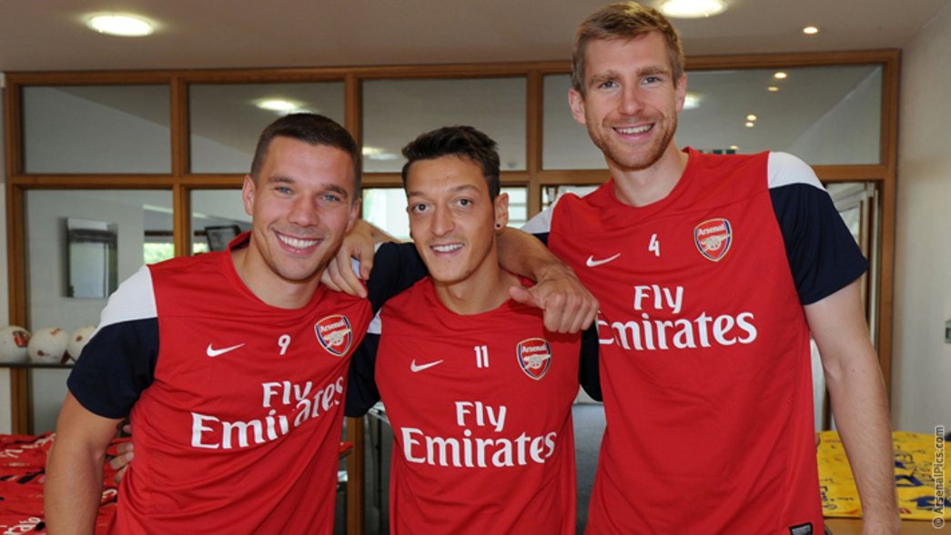 Lukas Podolski and Per welcome Mesut to Arsenal