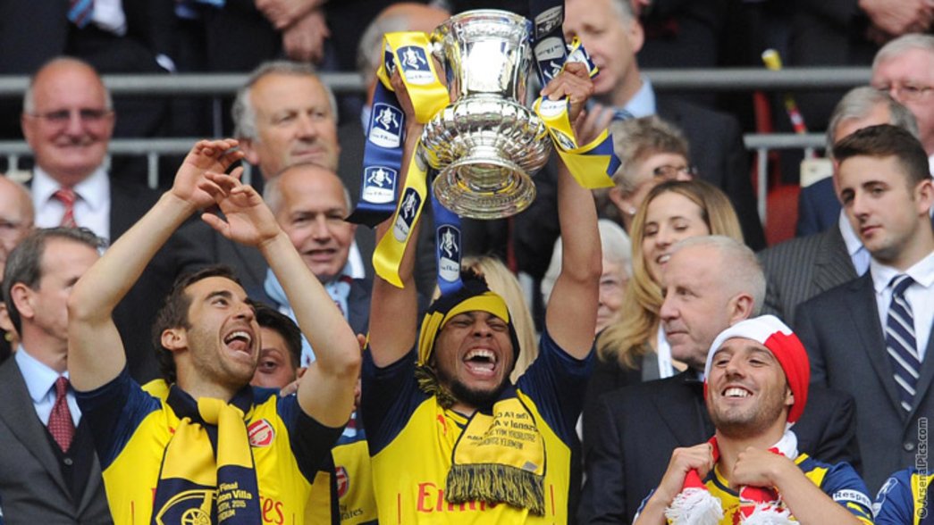 Francis Coquelin lifts the FA Cup
