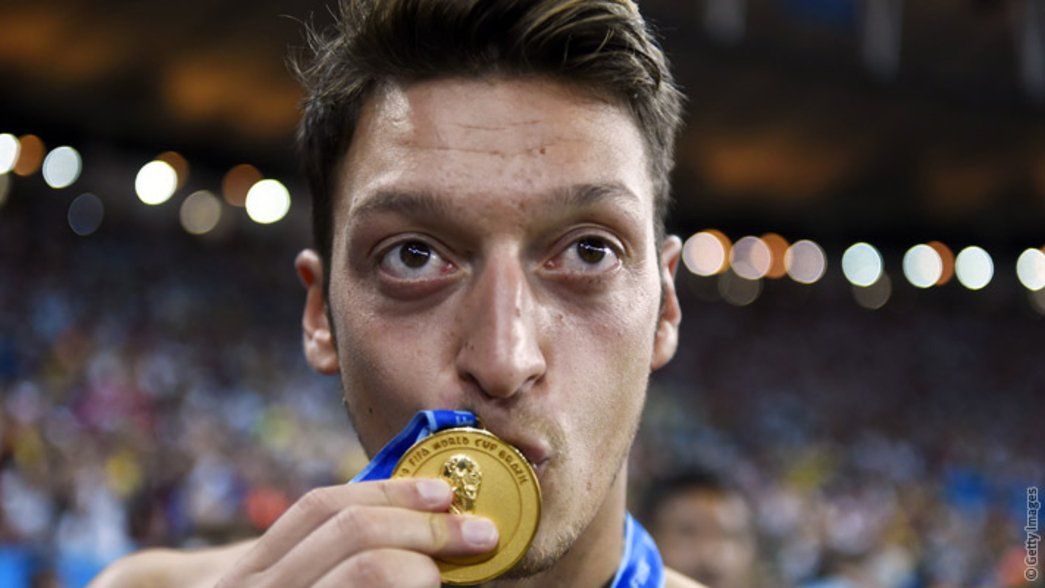 Mesut Ozil celebrates after winning the World Cup