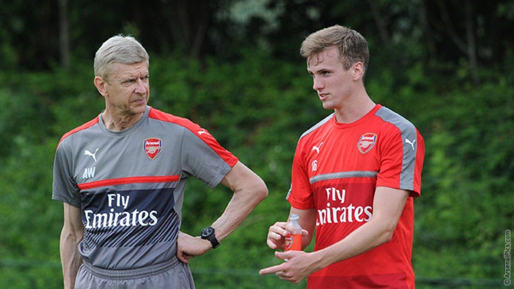 Arsene Wenger in conversation with summer signing Rob Holding