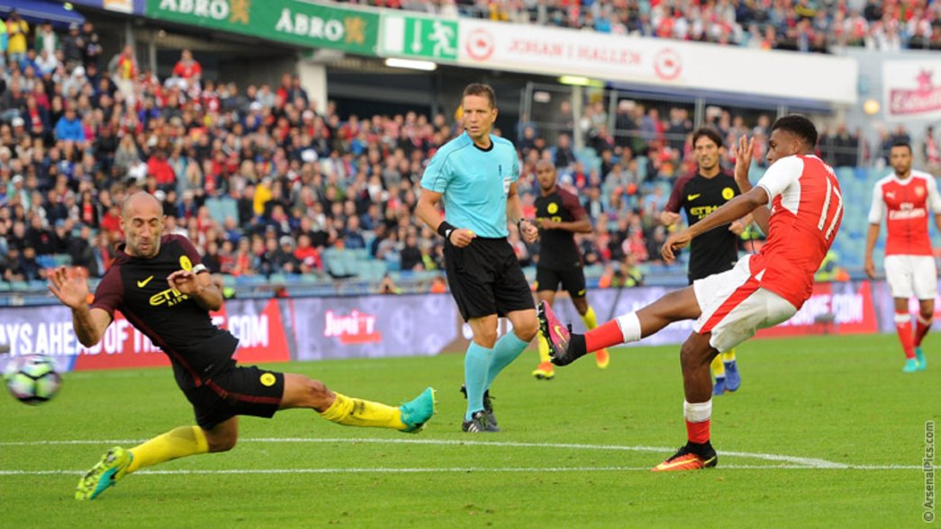 Alex Iwobi scores against Manchester City