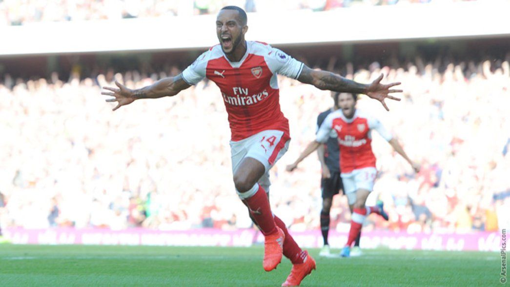 Theo Walcott celebrates after opening the scoring against Liverpool