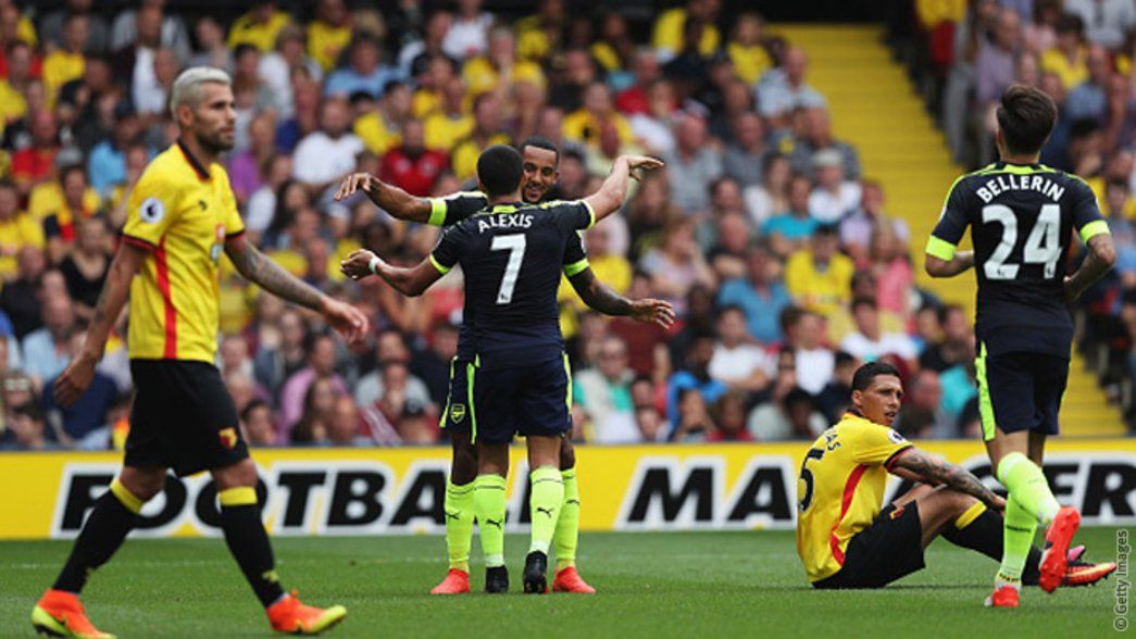 Theo Walcott and Alexis celebrate a goal against Watford