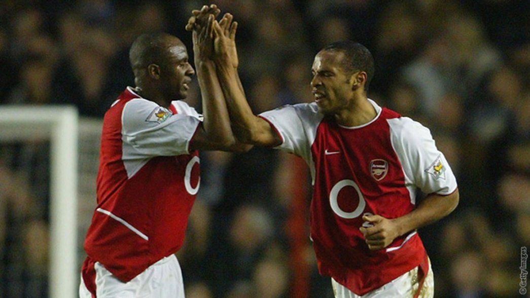 Thierry Henry celebrates with Patrick Vieira