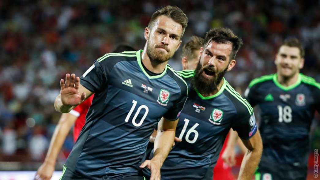 Aaron Ramsey celebrates scoring for Wales against Serbia