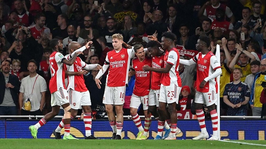 Arsenal celebrate scoring against AFC Wimbledon