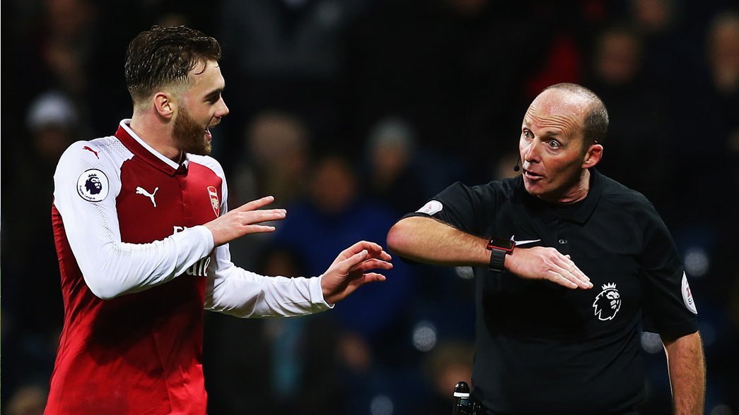 Calum Chambers remonstrates with Mike Dean after West Bromwich Albion were awarded a late penalty for handball