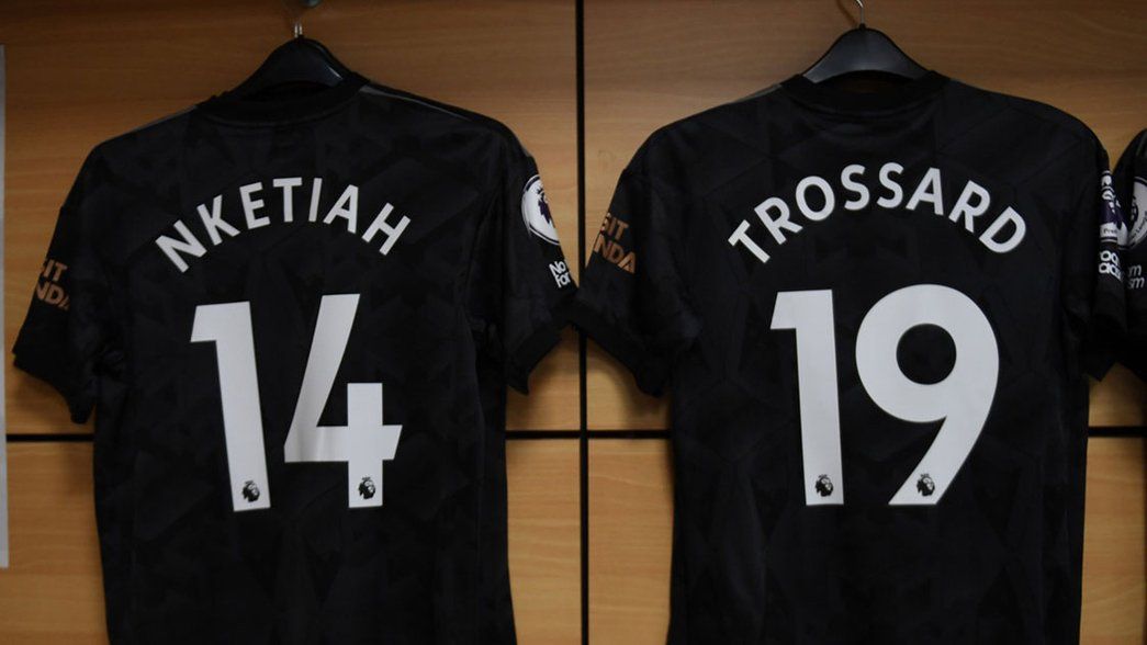 Nketiah and Trossard shirts in Villa dressing room