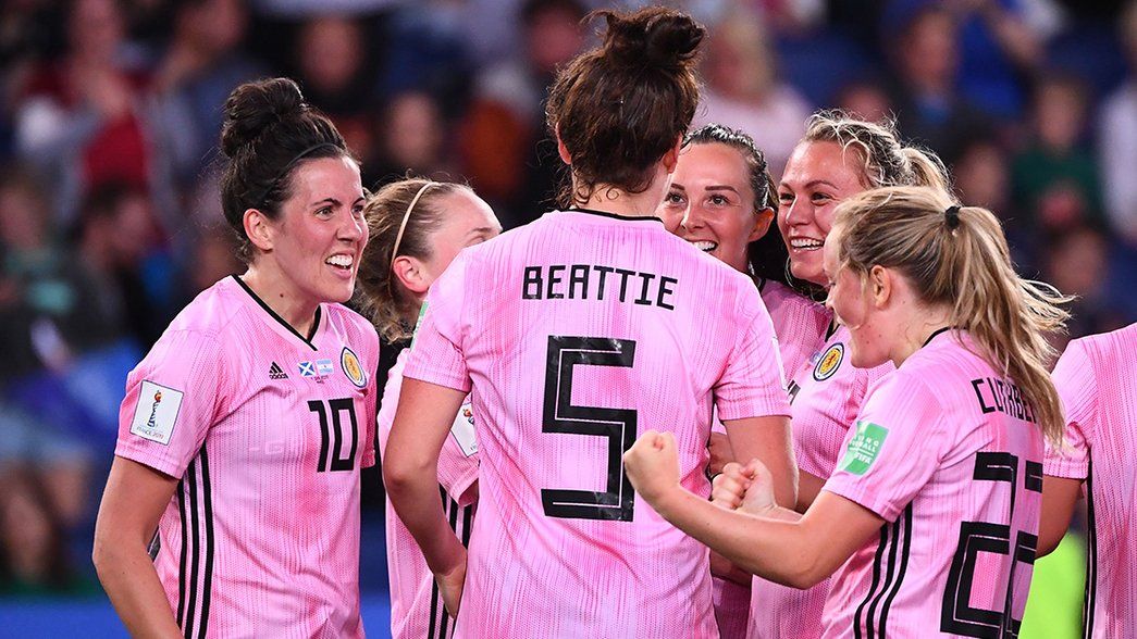 Jen Beattie celebrates with her Scottish teammates after scoring against Argentina in the World Cup