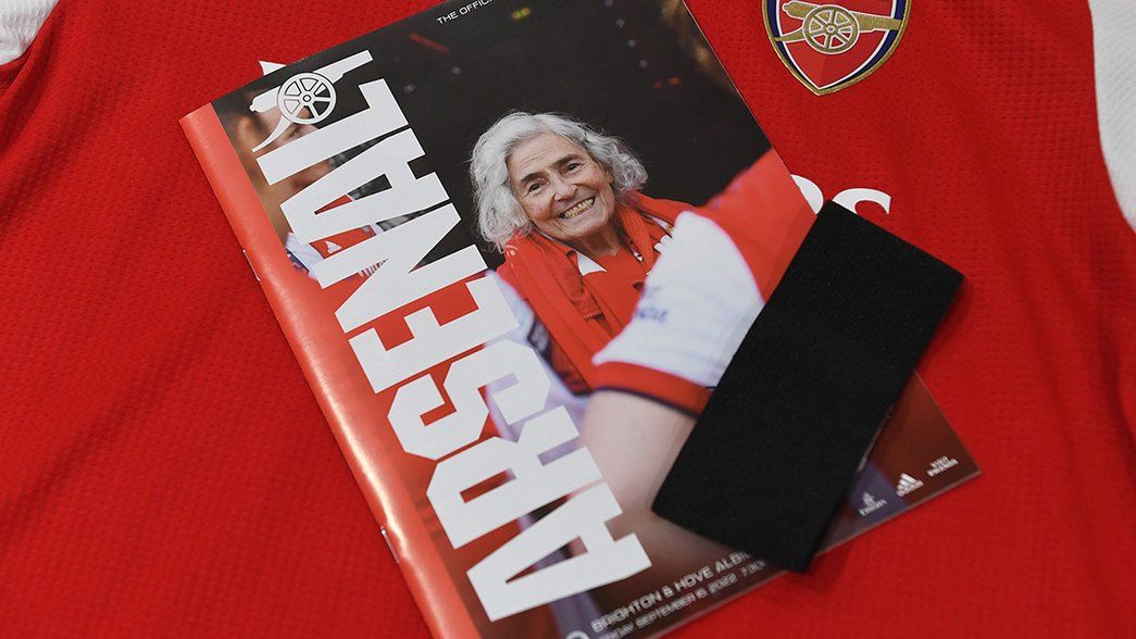 A black armband rests atop an official matchday programme memorialising Maria Petri