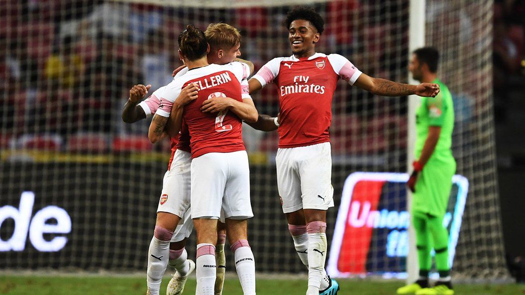 Hector Bellerin congratulates Emile Smith Rowe after his goal against Atletico Madrid in Singapore