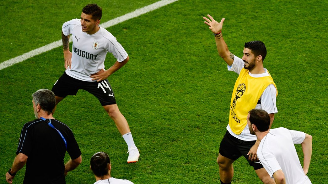 Lucas Torreira and Luis Suarez warming up with Uruguay