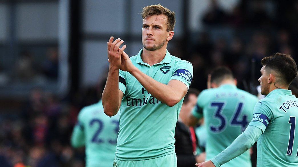 Rob Holding applauds the fans after our draw at Crystal Palace