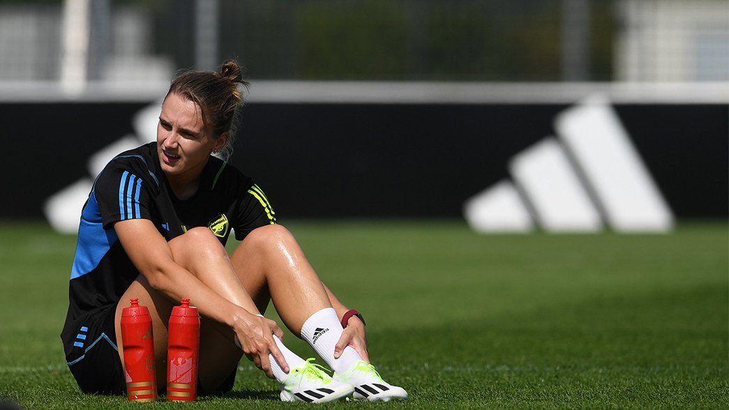Vivianne Miedema sits on the grass at adidas HQ