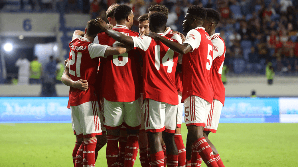 Arsenal celebrate scoring against AC Milan