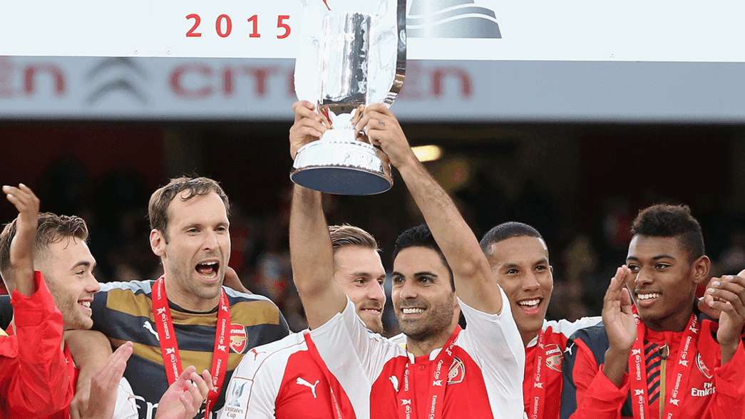 Mikel Arteta lifts the Emirates Cup in 2015
