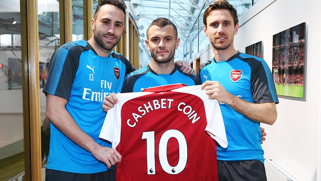 Cashbet Coin shirt held up by first team players