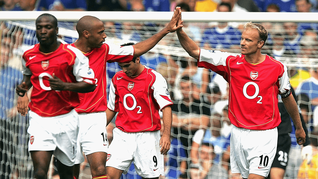 Thierry Henry and Dennis Bergkamp celebrate scoring against Everton in 2004