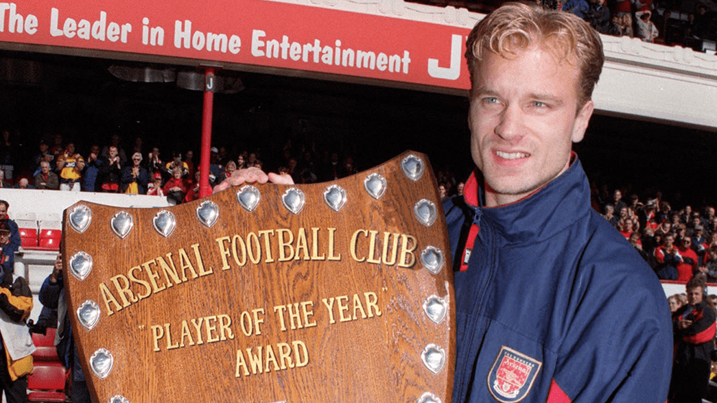 Dennis Bergkamp with the Arsenal Player of the Year trophy