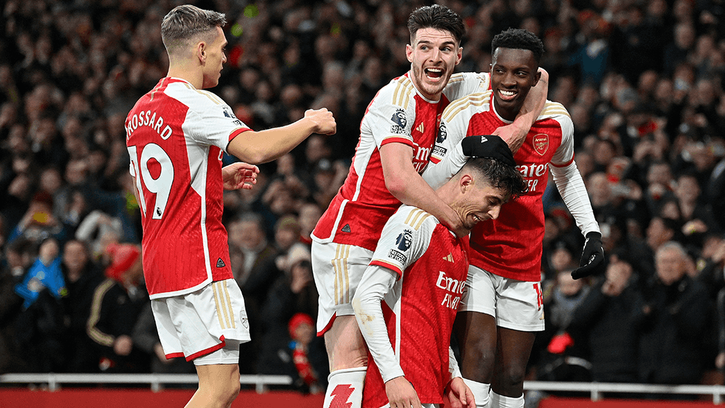 Arsenal celebrate scoring against Brighton
