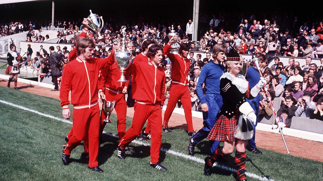 Arsenal parade the 1971 double trophies around Highbury
