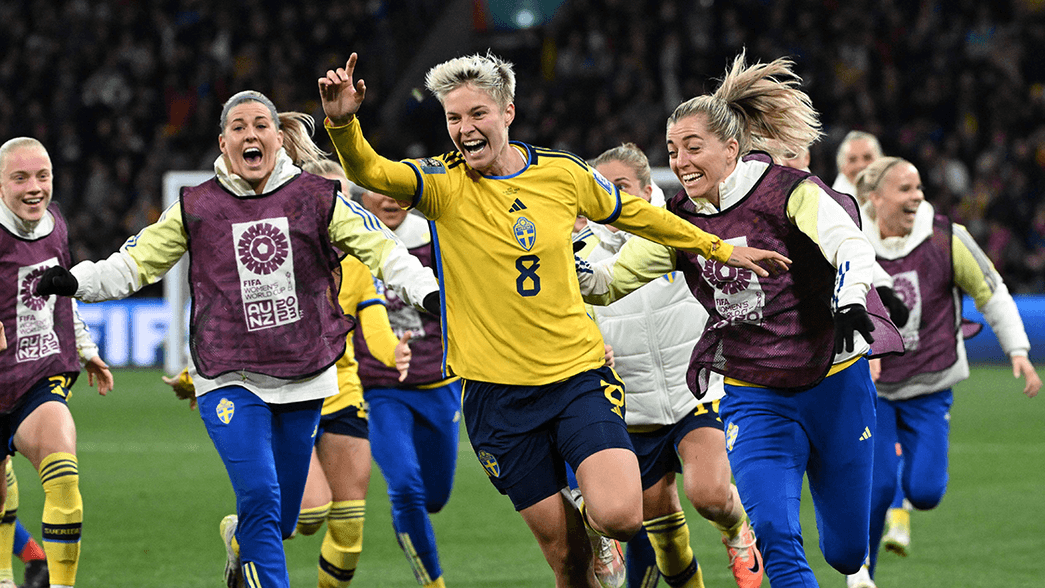 Lina Hurtig celebrates scoring the winning penalty against USA