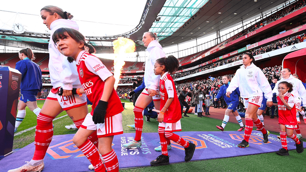 Mascots walking out with our players at Emirates Stadium