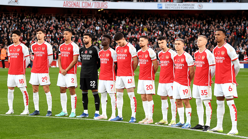 Arsenal players taking part in a minute's silence