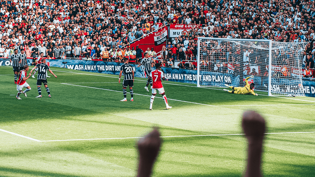 Martin Odegaard scoring against Manchester United