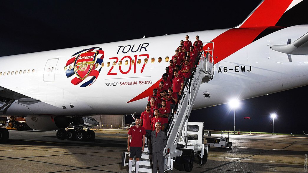 The Arsenal squad prepare to board the plane to Sydney