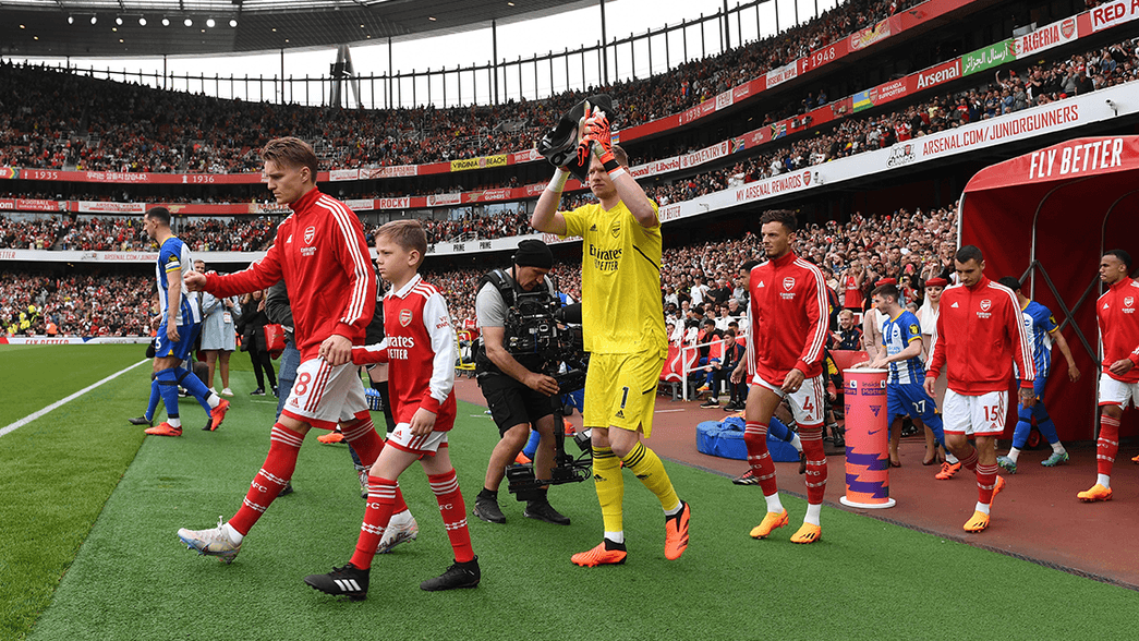 Arsenal and Brighton walk out of the tunnel before the game