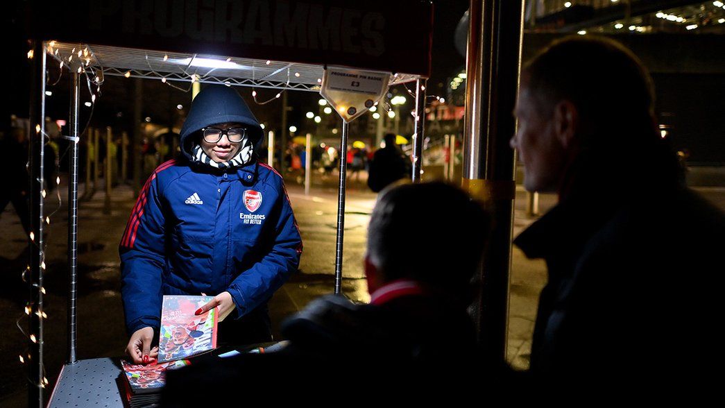 An official Arsenal programme vendor outside Emirates Stadium
