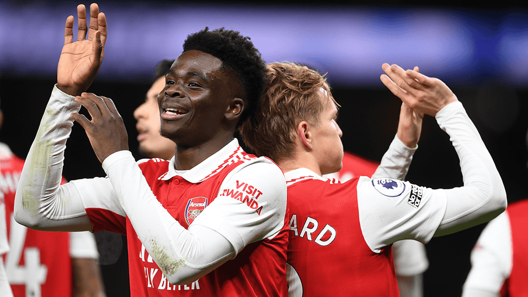 Bukayo Saka and Martin Odegaard celebrate a goal against Tottenham