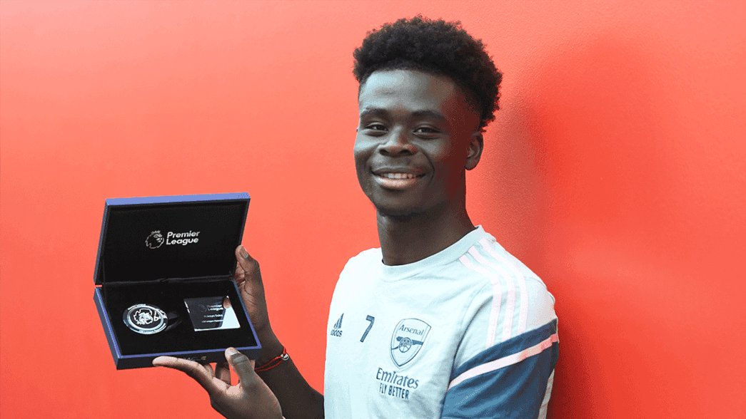 Bukayo Saka picks up his Premier League award for 100 games
