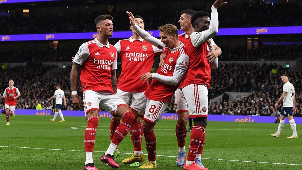 Arsenal celebrate scoring away at Tottenham